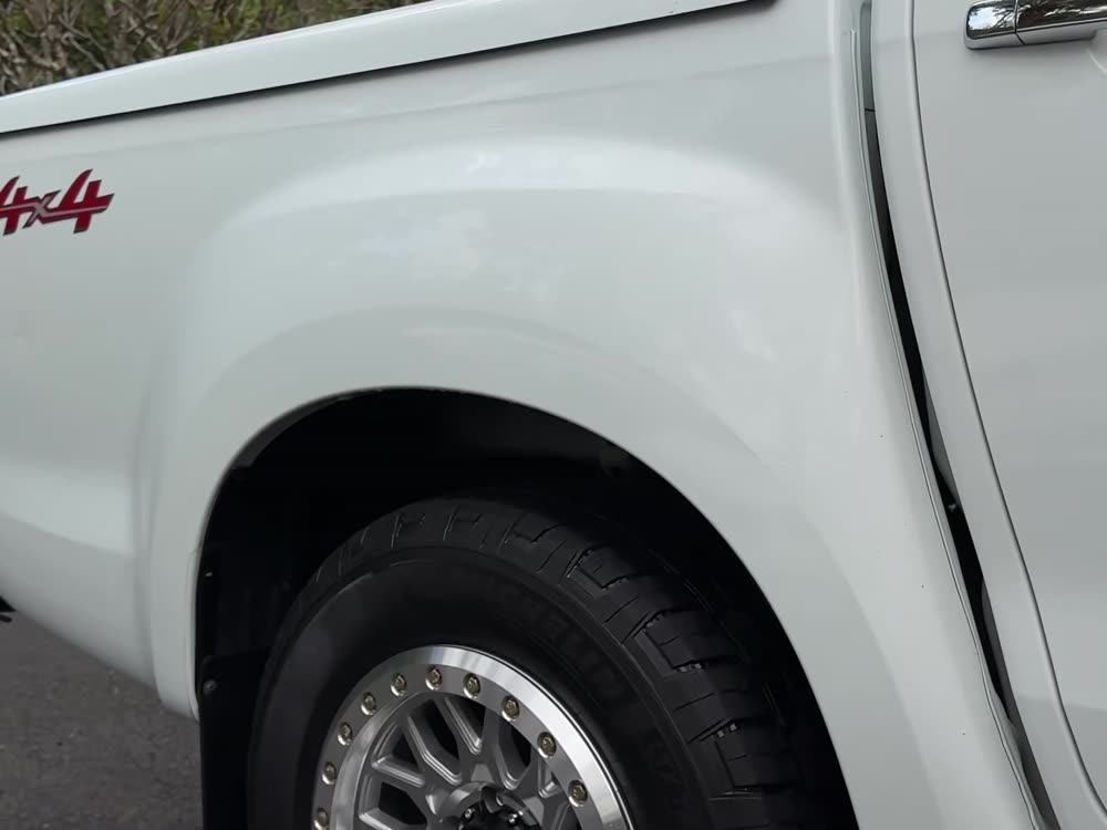 Cleaned alloy wheel and arch on a ute